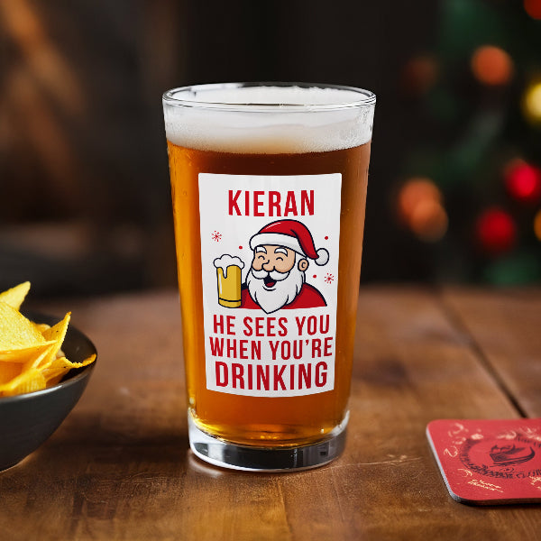 Personalised He Sees You When You’re Drinking Christmas Beer Glass