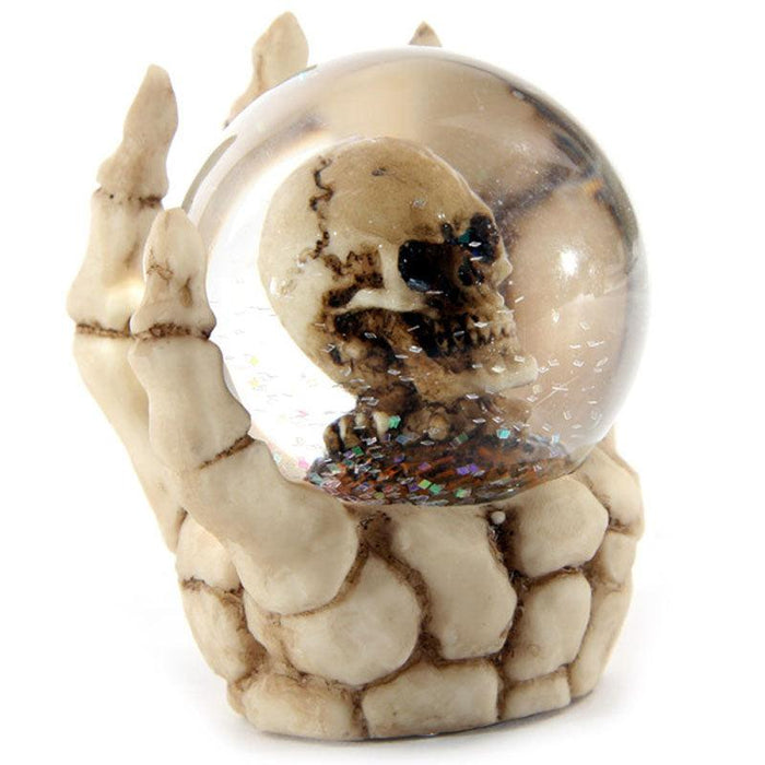 Skull Waterball Snow Globe in Skeleton Hand