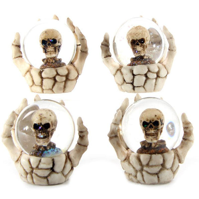 Set Of Four Skull Waterball Snow Globe in Skeleton Hand