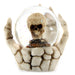 Skull Waterball Snow Globe in Skeleton Hand